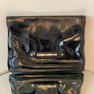 Elaine Turner clutch. Black with pink interior. Gold label w/a slide in flap.